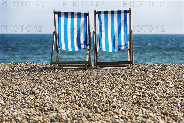 Two empty deck chairs