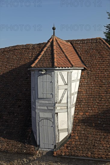 Half-timbered bay window with two wooden doors