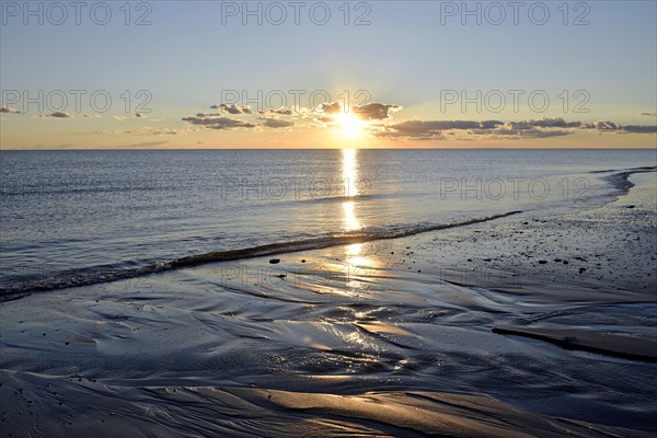 Sunset at the sandy beach Nebel