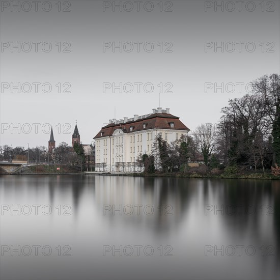 View over the Dahme river to Koepenick Castle and the Long Bridge in Berlin in the morning