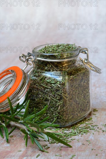 Dried rosemary in glass jar