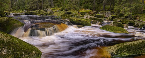 Waterfall at the Vydra with huge boulders in the riverbed