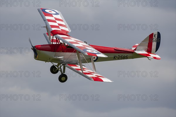 De Havilland DH.82 Tiger Moth aircraft in flight in Royal air force markings