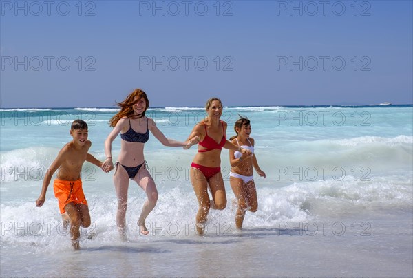 Family in the water bathing