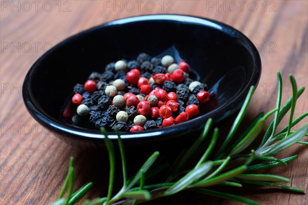 Black and white peppercorns in shell