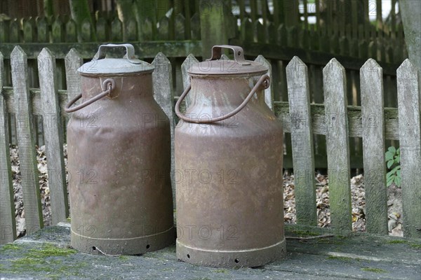 Rusty old iron milk cans