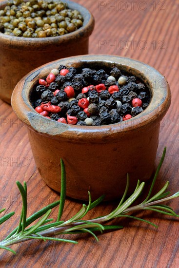 Black and white peppercorns in shell