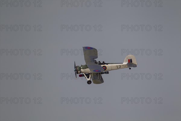 Fairey Swordfish aircraft in flight in Royal Navy markings