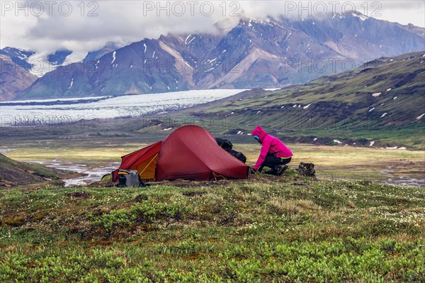 Woman next to tent