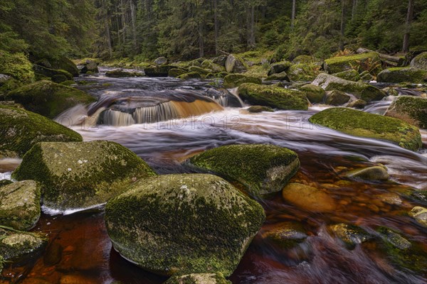 Waterfall at the Vydra with huge boulders in the riverbed