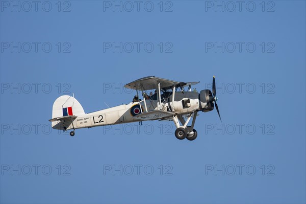 Fairey Swordfish aircraft in flight in Royal Navy markings