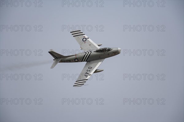 North American F-86 Sabre aircraft in flight in United States Airforce markings