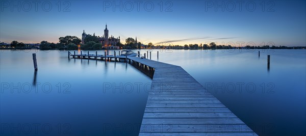 Wooden footbridge at Schwerin Lake at dusk