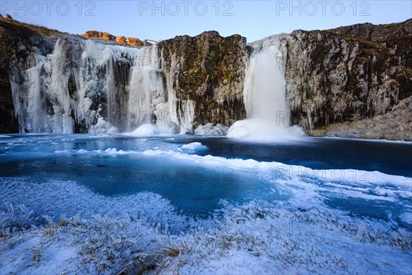 Kirkjufellsfoss waterfall in winter