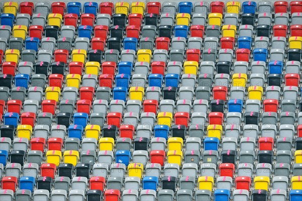 Colourful seating shells in the empty Merkur-Spiel-Arena