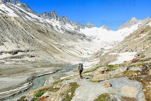 Mountaineer at the foot of the Oberaar glacier