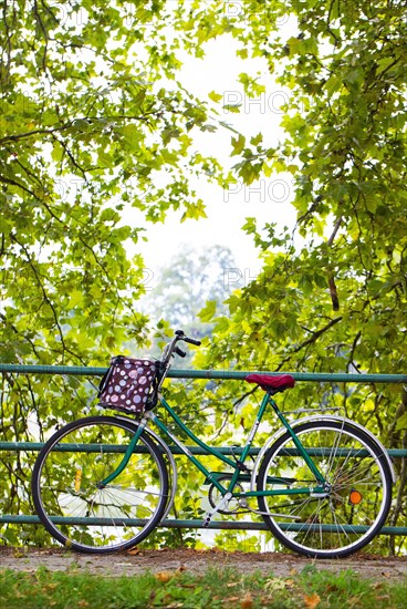 Bicycle leaning on the railing