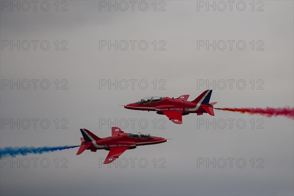 BAE Systems Hawk two aircraft of the Royal Air Force Red Arrows display team in flight