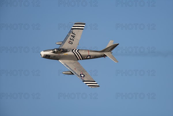 North American F-86 Sabre aircraft in flight in United States Airforce markings