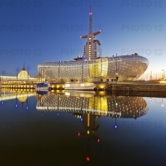 Illuminated Klimahaus Bremerhaven in the evening