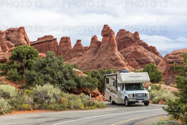 Motorhome in front of rock scenery