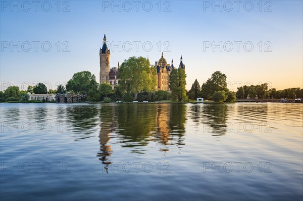 Schwerin Castle reflected in Schwerin Lake in the evening light
