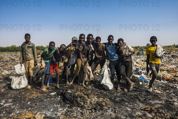 Local boys posing on a dump