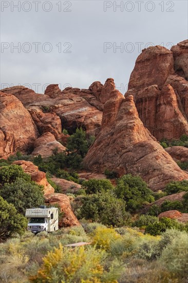 Motorhome in front of rock scenery