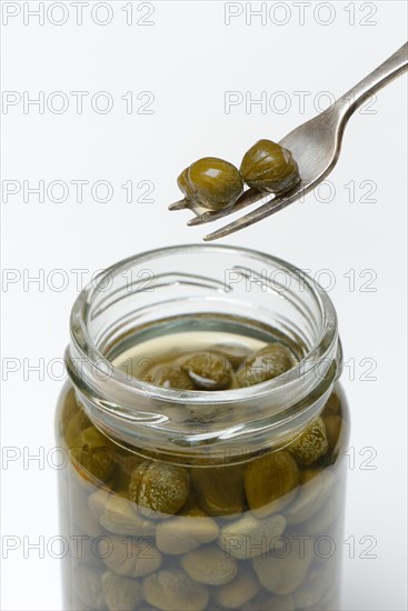 Capers on fork and glass with inlaid capers