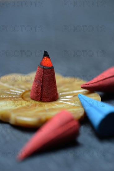 Burning incense cone