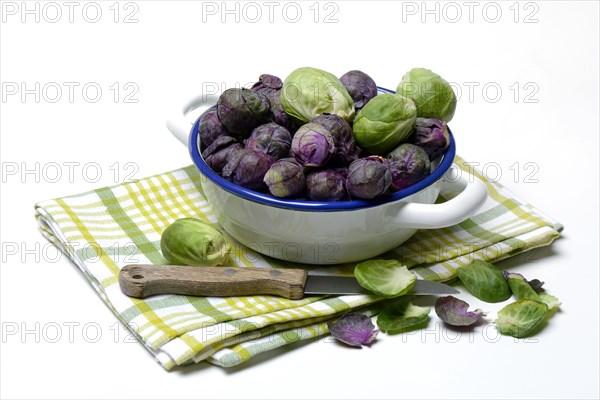 Purple and green Brussels sprouts in a bowl