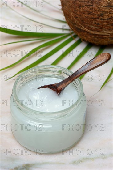 Coconut oil with wooden spoon