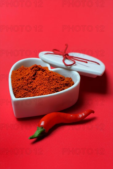 Chili powder in bowl with heart shape