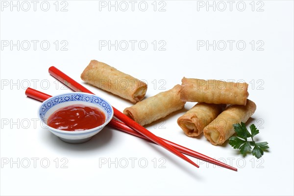 Spring roll and bowl with sauce