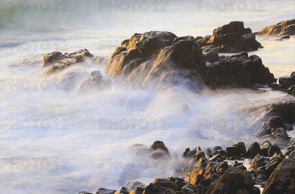 Rocks and waves on the sea coast near Bamburgh