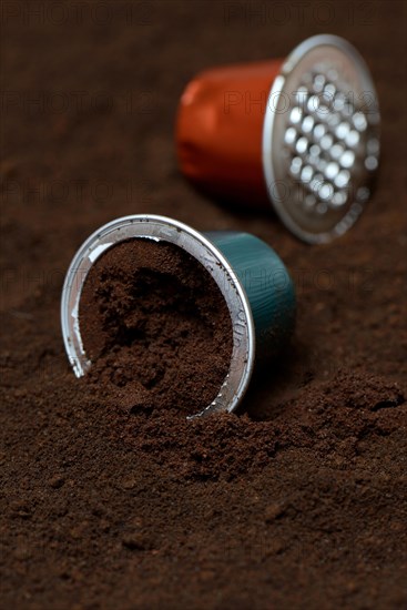 Opened coffee capsule and coffee powder