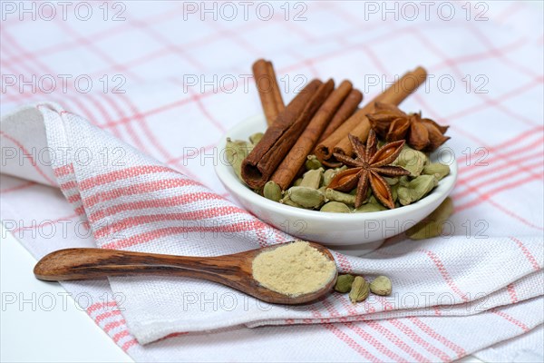 Christmas spices in bowl and powder in spoon