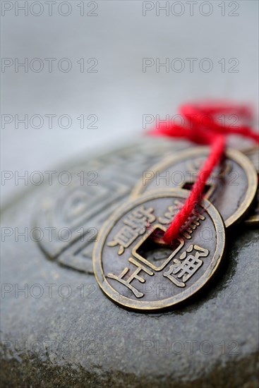 Chinese lucky coins on stone with seal