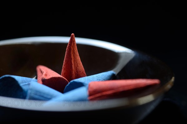 Different incense cones in bowl