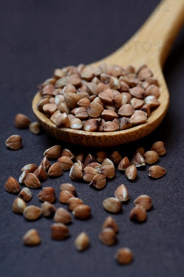 Buckwheat in wooden spoon