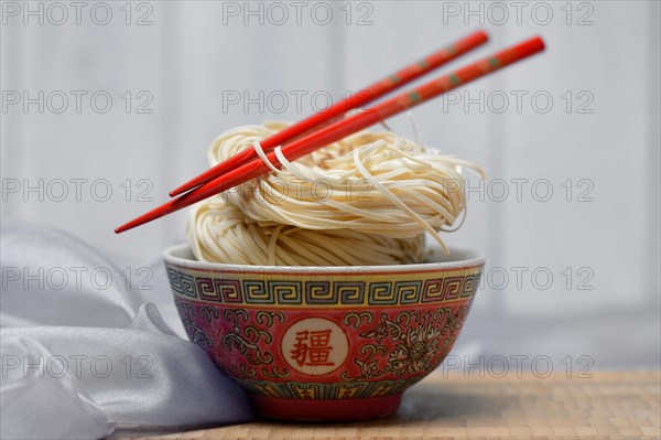 Chinese Yangchun noodles in bowl with chopsticks