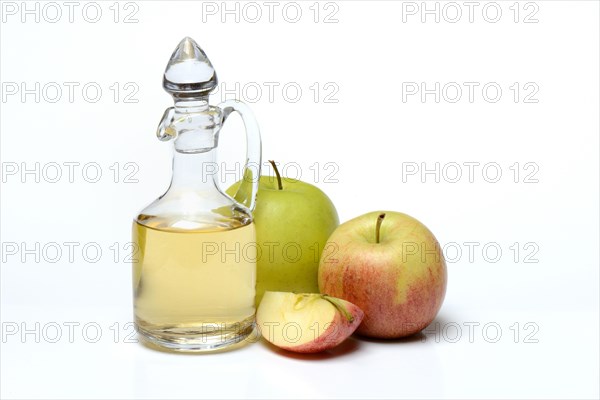 Carafe with apple vinegar and apples