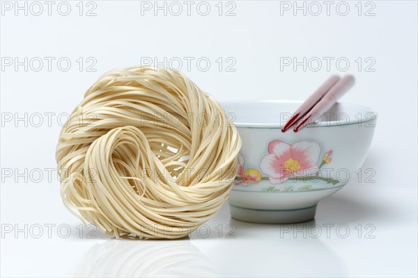 Chinese noodles and bowl with chopsticks