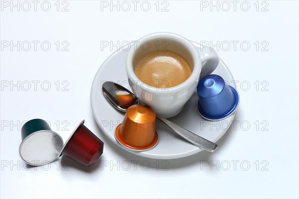 Coffee capsules and coffee cup with espresso