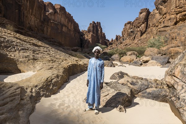 Young Beduin in traditional clothes at Guelta d'Archei waterhole