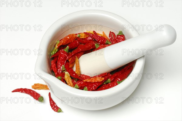 Dried chilli peppers in grating bowl