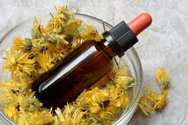 Dried calendula blossoms in bowl