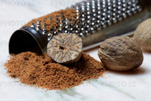 Nutmegs and nutmeg powder with grater