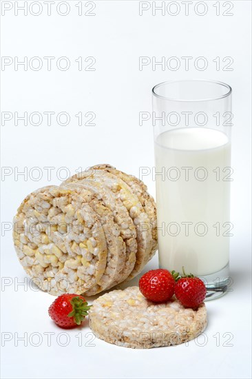 Corn and rice waffles with glass of milk and strawberries