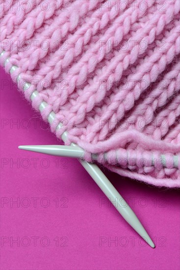Knitted wool with knitting needles